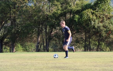 Captain Spencer Hamilton carries the ball up field