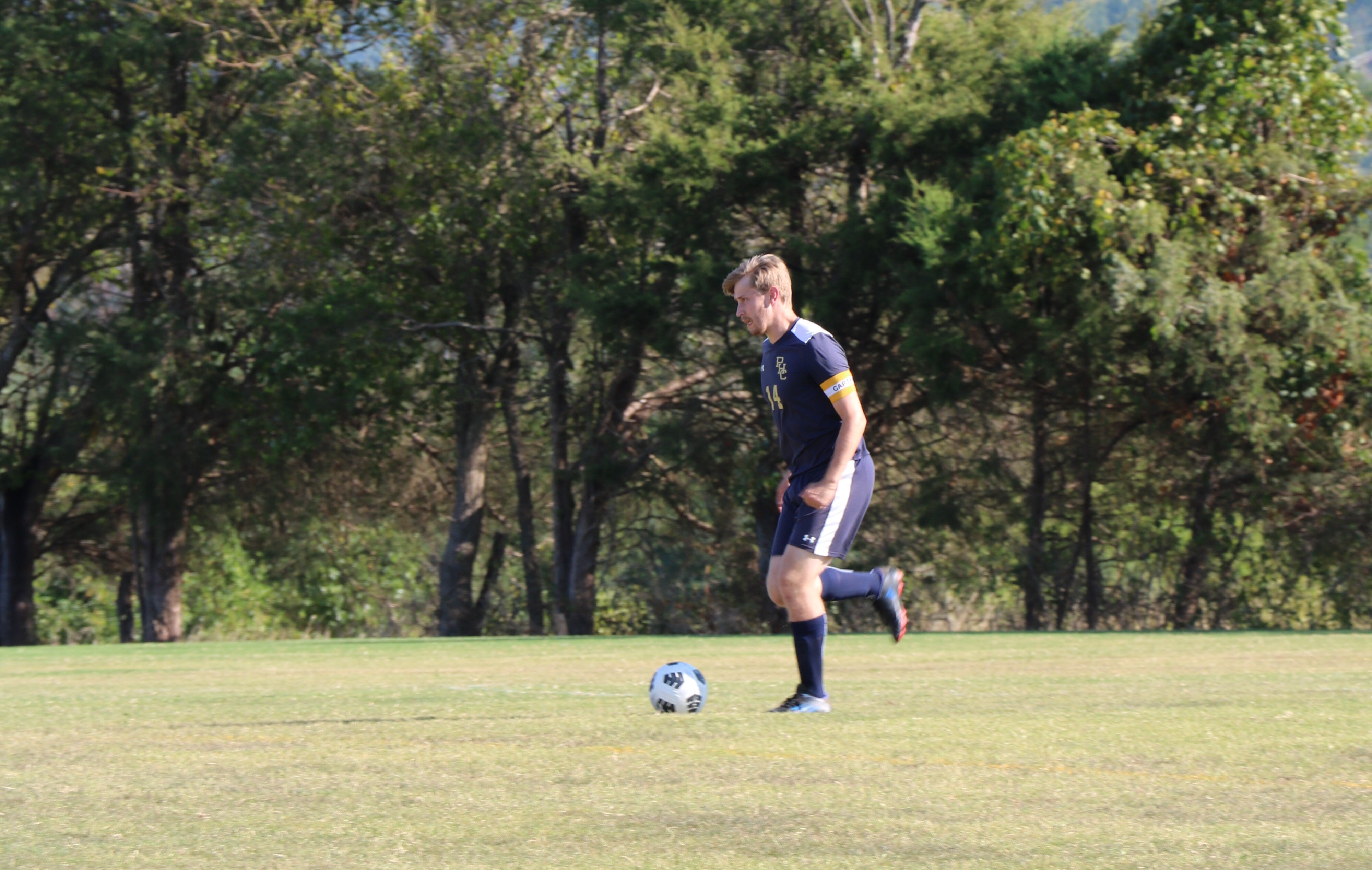 Captain Spencer Hamilton carries the ball up field